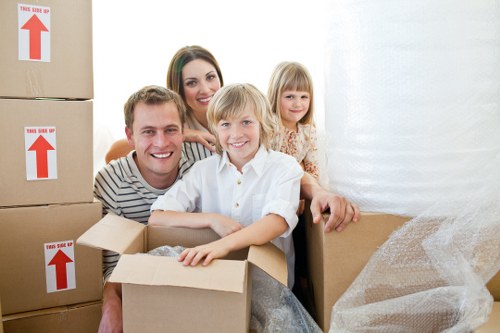 Professional team handling office furniture and equipment for a local move