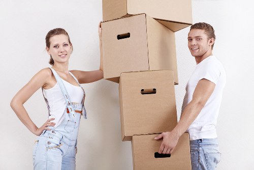 Local removals team handling boxes and furniture in Shacklewell